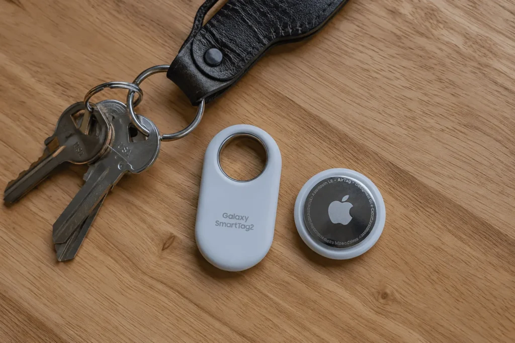 Samsung SmartTag2 next to an Apple AirTag for size comparison