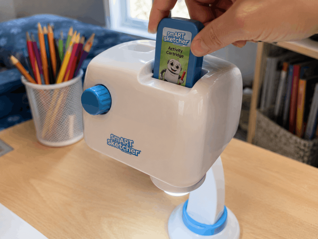 Inserting an activity cartridge into a Smart Sketcher projector