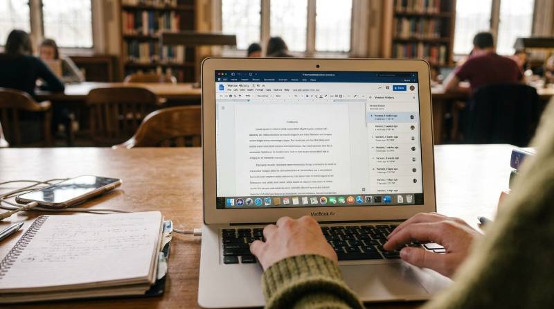 Version history on a laptop showing proof of writing when Grammarly AI is questioned